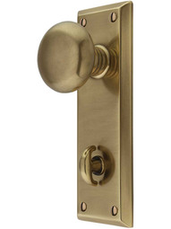 Quincy Thumb-Turn Door Set with Providence Knobs in Antique Brass.